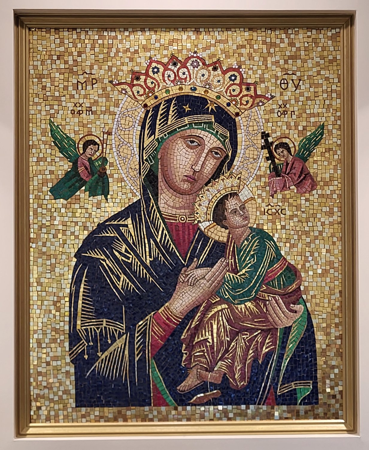 The a mosaic Our Lady of Perpetual Help, which adorned the Cathedral of St. Joseph for 43 years, now stands out brightly under new lights behind the reception desk in the Alphonse J. Schwartze Memorial Catholic Center in Jefferson City.